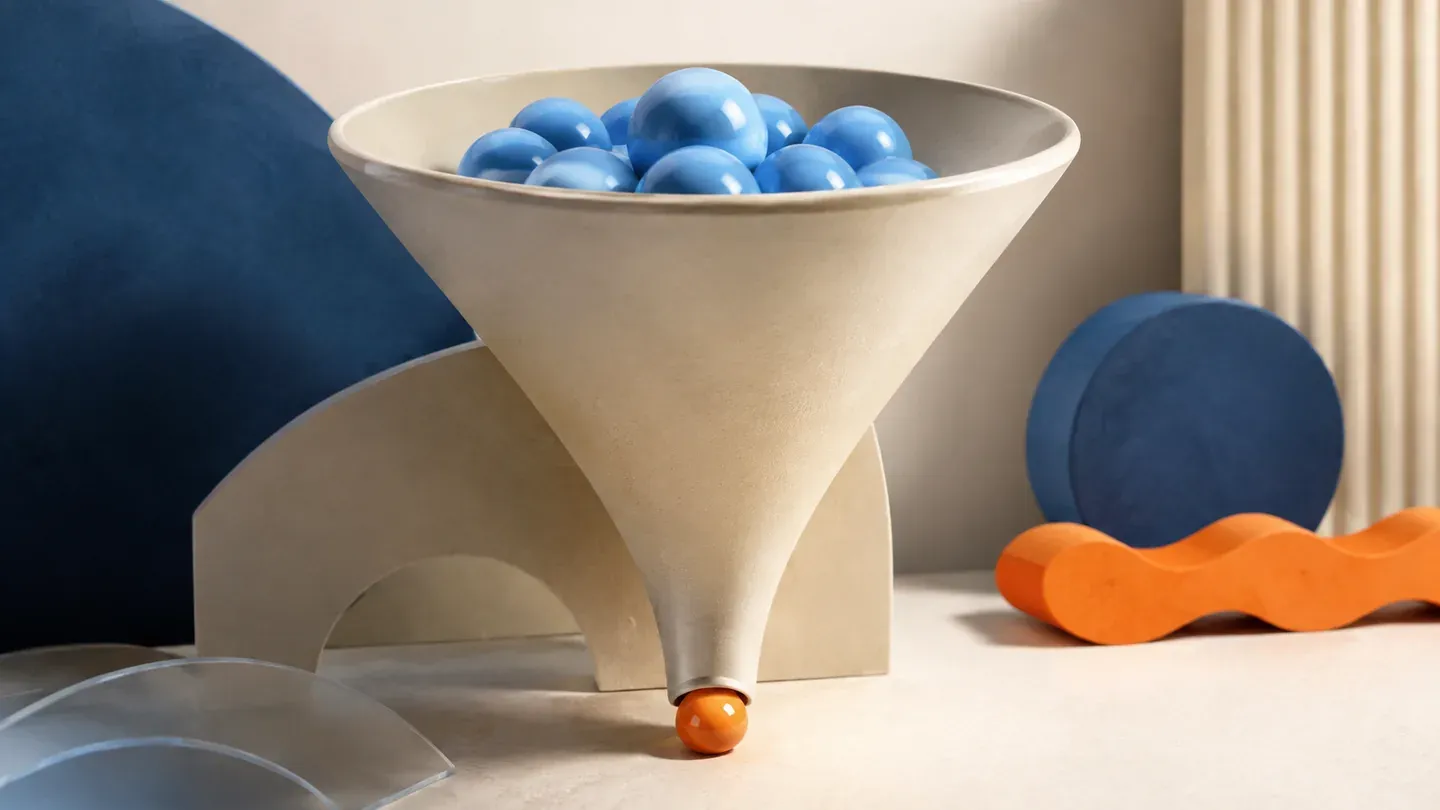 A cream funnel guides blue beads toward a single orange bead at its opening.