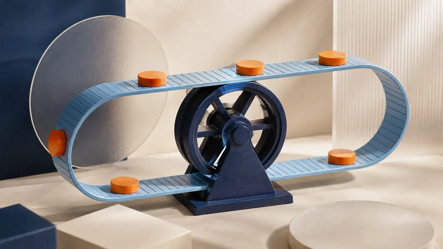 Orange discs rest on a continuous blue loop around a navy wheel.