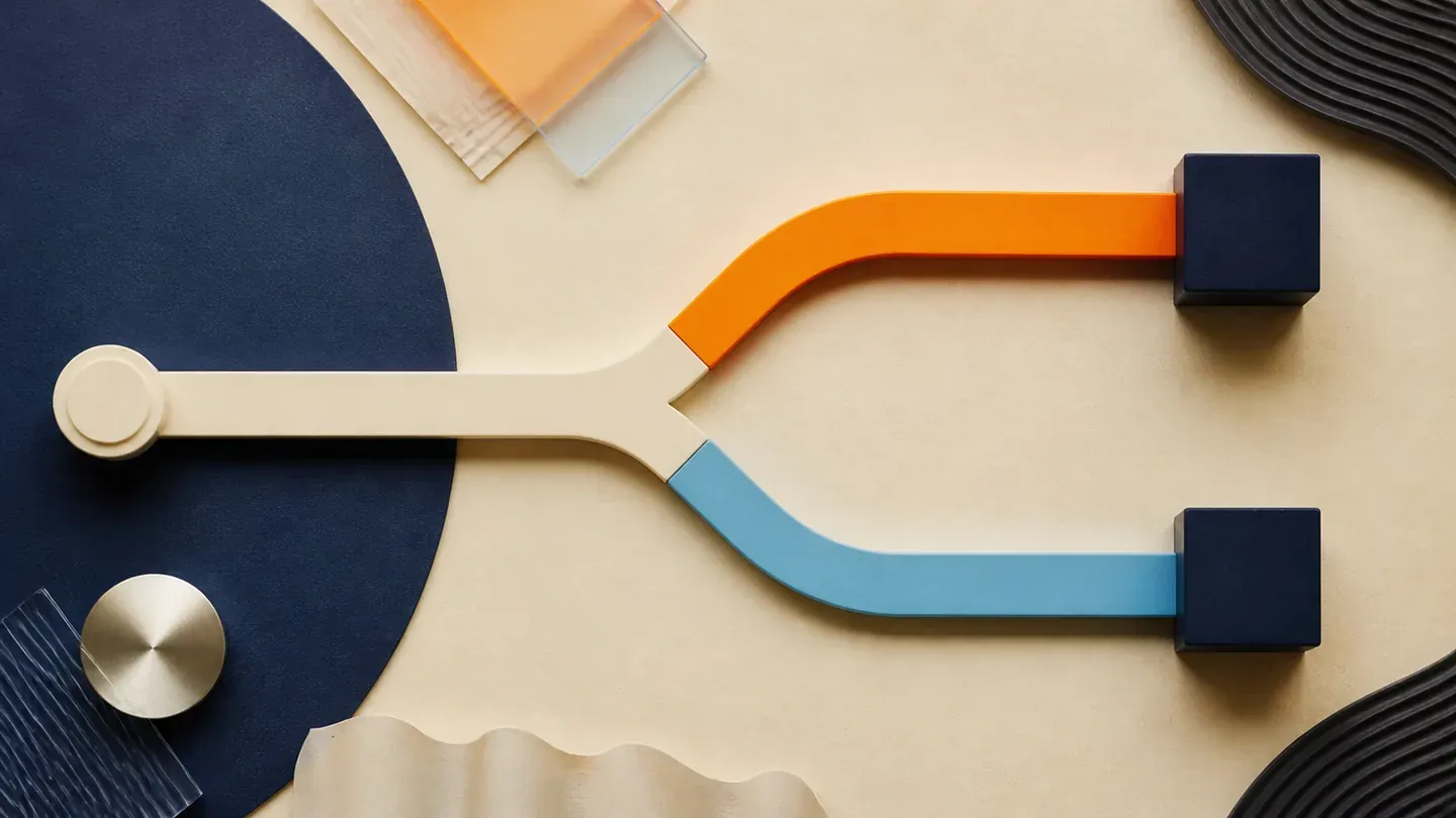 A cream rail divides into equal orange and blue paths ending in navy cubes.